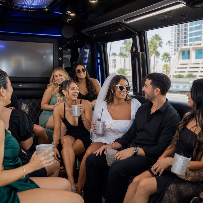 Party bus interior with wraparound leather seating and LED lighting in St. Petersburg