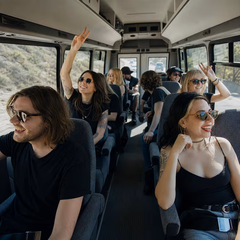Party bus interior with wraparound leather seating and LED lighting in St. Petersburg