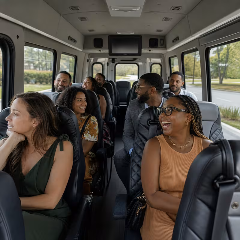 Group boarding a white charter bus for Private Event Transportation transportation in St. Petersburg