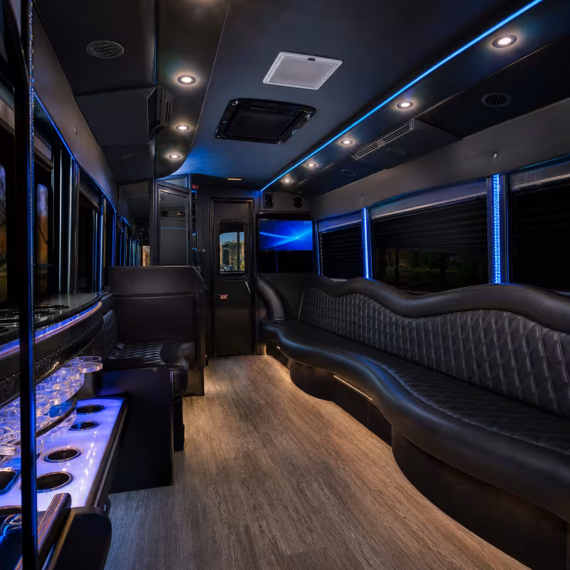 Party bus interior with wraparound leather seating and LED lighting in St. Petersburg