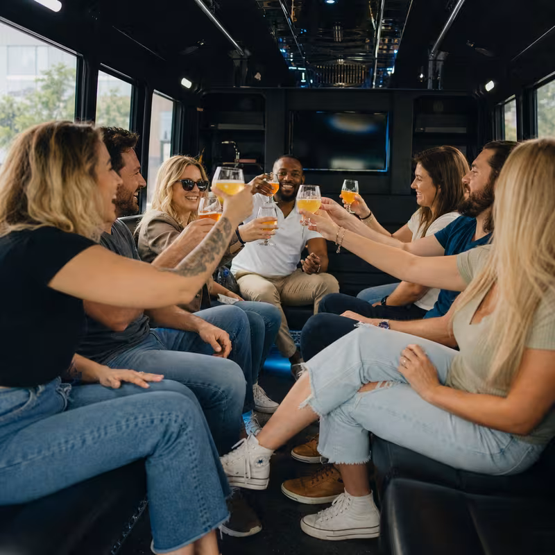 Group boarding a white charter bus for Winery & Brewery Tour Transportation transportation in St. Petersburg