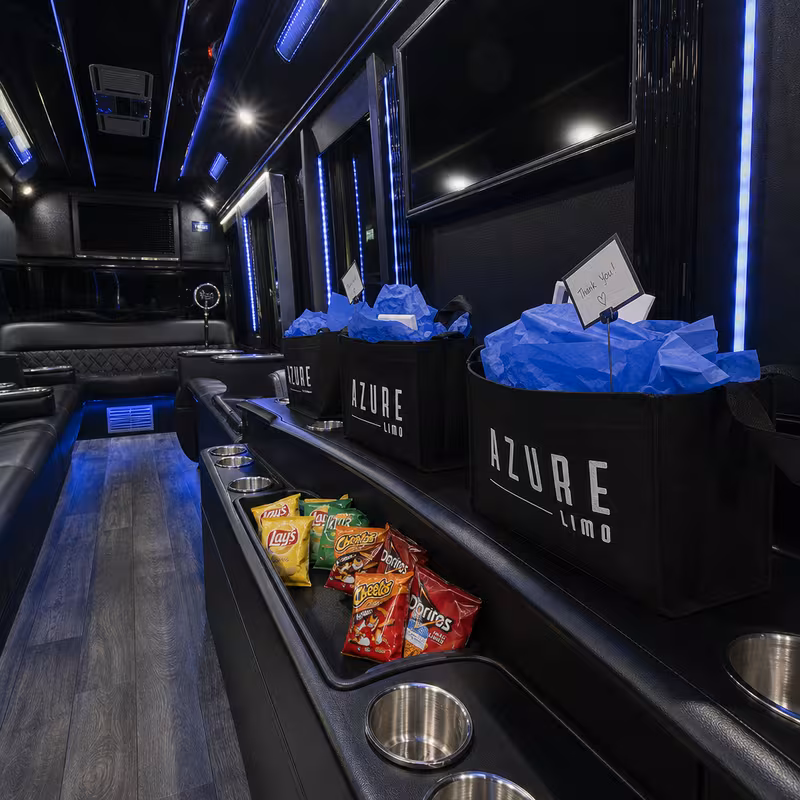 Party bus interior with wraparound leather seating and LED lighting in St. Petersburg